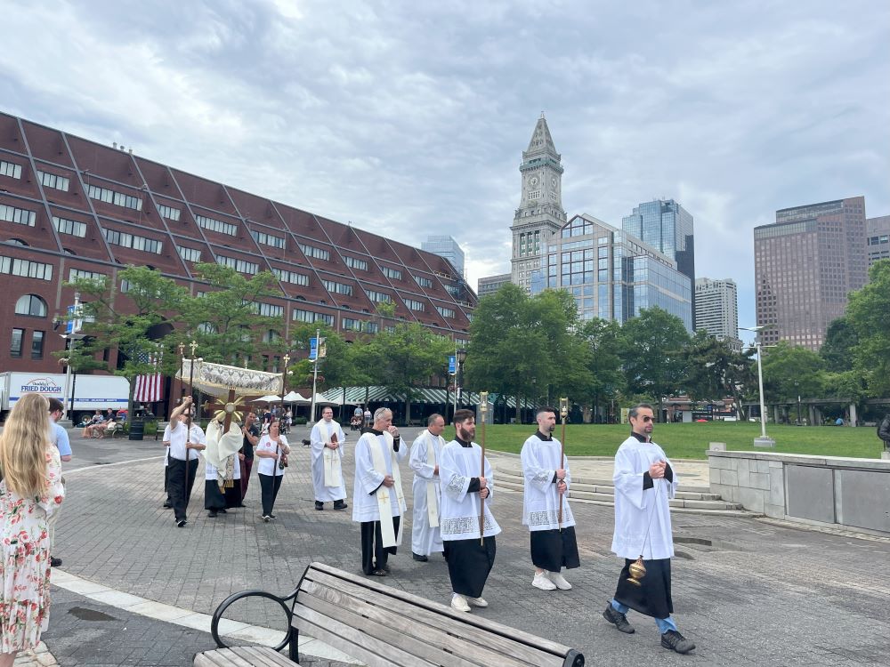The procession walks toward the altar, with Boston's Custom House in the background. (Greta Gaffin) The procession walks toward the altar, with Boston's Custom House in the background. (Greta Gaffin)