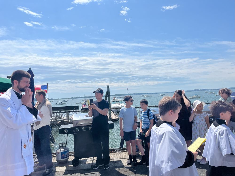 Fr. Peter Schirripa, parochial vicar at Gate of Heaven and St. Brigid of Kildare Parish, follows altar boys to the street. Fr. Peter Schirripa, parochial vicar at Gate of Heaven and St. Brigid of Kildare Parish, follows altar boys to the street.