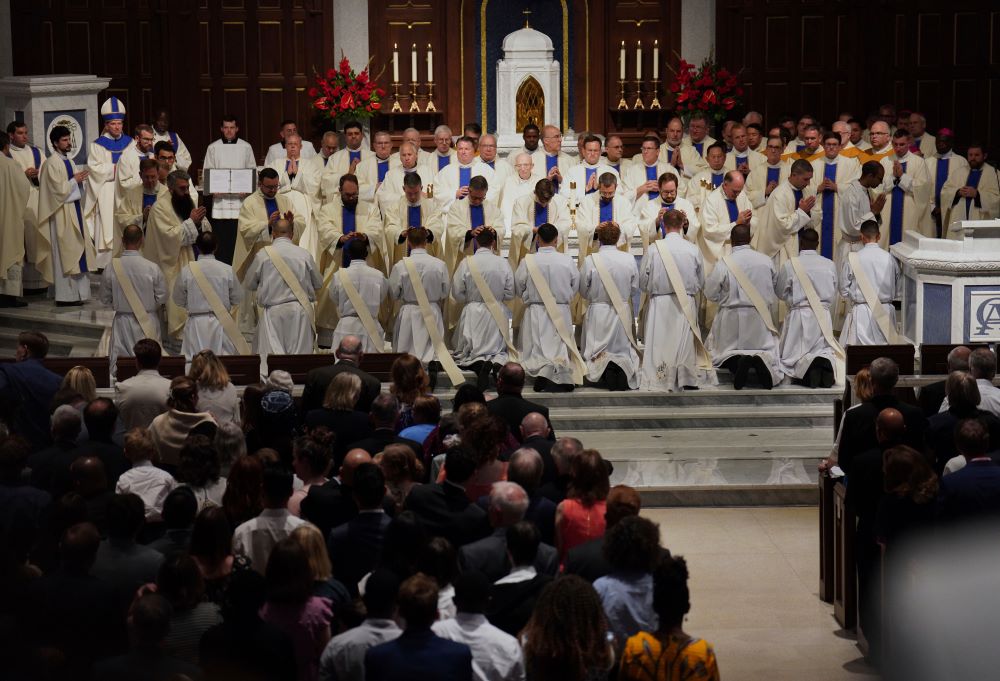 Priests and bishops bless the 12 newly ordained priests during Mass at the Cathedral of St. Thomas More in Arlington, Va., on June 7. (AP/Jessie Wardarski) Priests and bishops bless the 12 newly ordained priests during Mass at the Cathedral of St. Thomas More in Arlington, Va., on June 7. (AP/Jessie Wardarski)