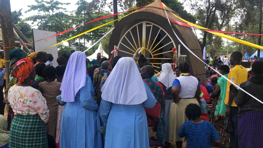 Catholic sisters and other pilgrims face the shrine of St. Charles Lwanga at Namugongo. 
