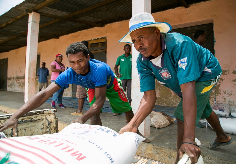 Workers unload food supplies from Catholic Relief Services and USAID.