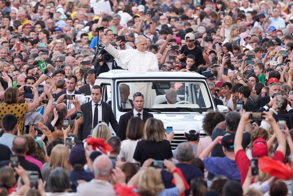 Popemobile in crowd