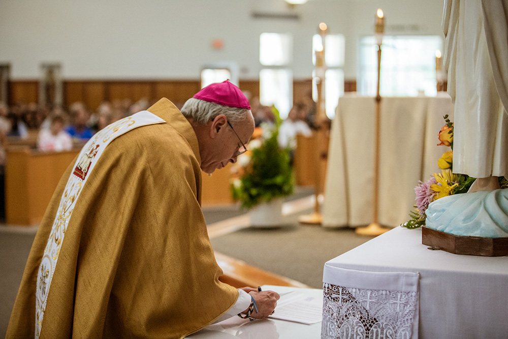 Bishop Mark Seitz signs a letter committing the Diocese of El Paso, Texas, to participating in the Laudato Si' Action Platform, a Vatican initiative aimed at mobilizing Catholic institutions to put into action the teachings of Pope Francis in his 2015 encyclical "Laudato Si', on Care for Our Common Home." (Diocese of El Paso, Texas)