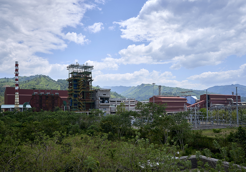The Los Pinares iron ore processing plant in northern Honduras looms over the peasant community of Nueva Lempira. Residents say the project, which is currently suspended by the government, will force them to choose between living with contamination or moving elsewhere. The community received support in their opposition from Juan López, who was assassinated Sept. 14, 2024, in Tocoa. (NCR photo/Paul Jeffrey)