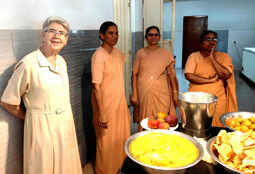 Franciscan Sisters of the Immaculate Sr. Maria Rosa (far left) is pictured with her Indian colleagues (left to right) Srs. Sagaya Rani, Marneni Jayamma and Sindhuja before serving lunch to the residents of Sumanahalli in Bengaluru, southern India. (Thomas Scaria)