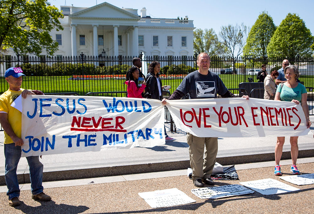Art Laffin, center, of the Dorothy Day Catholic Worker, participates in a protest for peace with other demonstrators outside of the White House April 15, 2016. (CNS/Chaz Muth) 