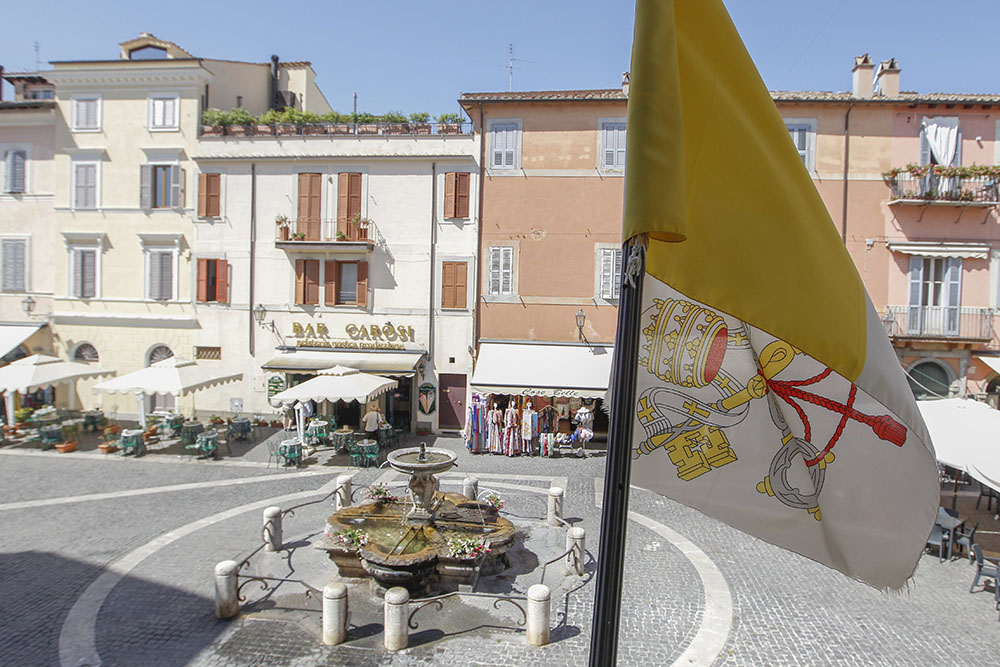 The Vatican flag flies over the main square in Castel Gandolfo, Italy, Aug. 14, 2020. (CNS/Robert Duncan)