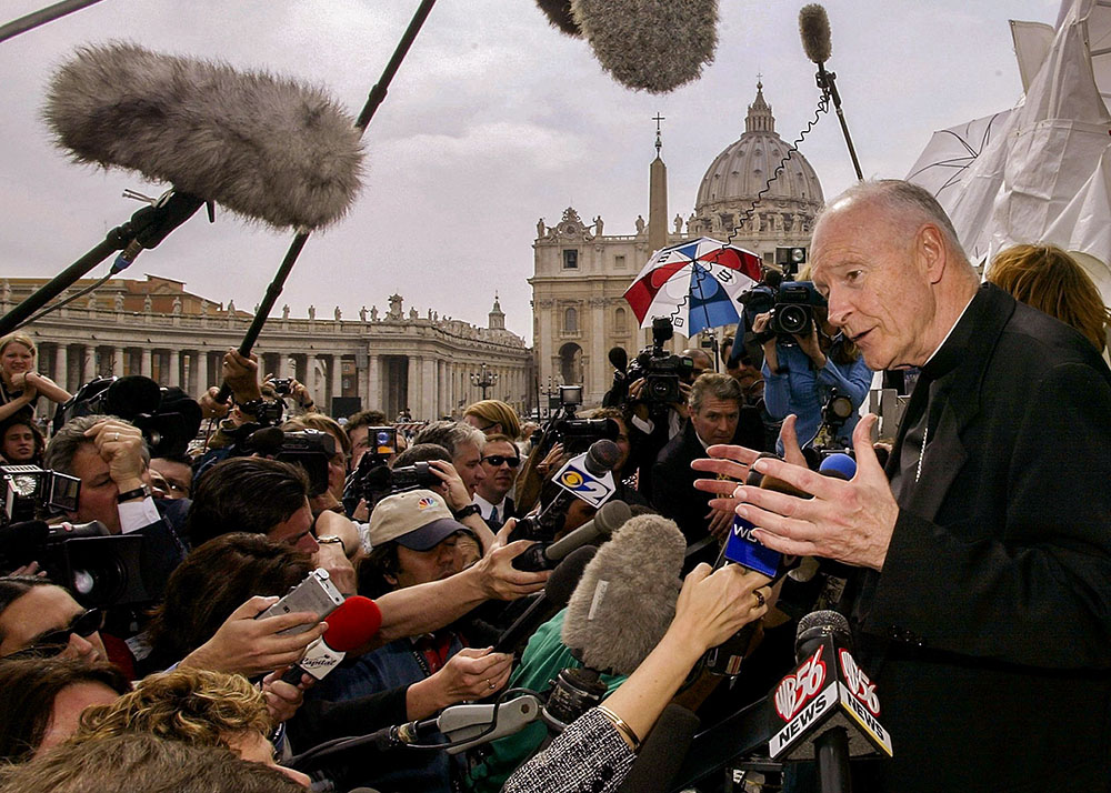 Then-Cardinal Theodore McCarrick of Washington faces the press in the shadow of St. Peter's Basilica at the Vatican April 24, 2002. U.S. cardinals were meeting for a summit with Pope John Paul II at the Vatican, as the sex abuse crisis unfolded in the United States. (CNS/Reuters/Paolo Cocco)