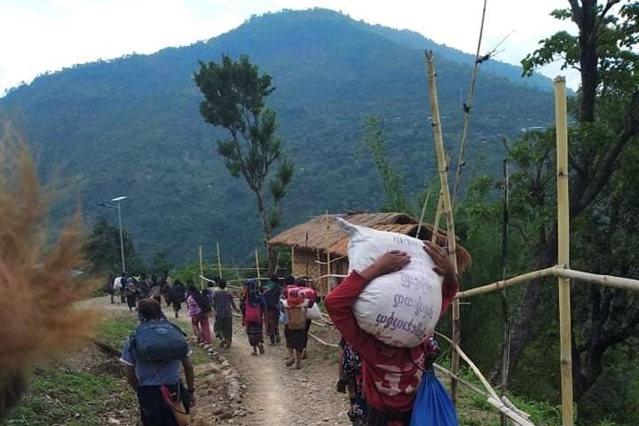 People in northwestern Myanmar displaced by fighting between junta forces and anti-junta fighters walk in Chin state May 31, 2021. A third church in Kayah state, a Catholic stronghold in eastern Myanmar, was damaged by indiscriminate shelling by the military June 6. (CNS/Reuters)