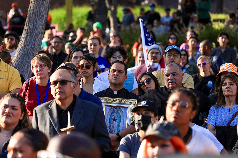 A member of the clergy holds an image of Our Lady of Guadalupe at a vigil in Grand Park in downtown Los Angeles June 10, 2025, as protests against federal immigration sweeps continue. (OSV News/Reuters/David Swanson)