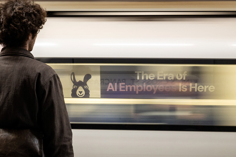 A London underground train passes a billboard for an artificial intelligence company advertising AI employees June 5, 2025. (OSV News/Reuters/Chris J. Ratcliffe)