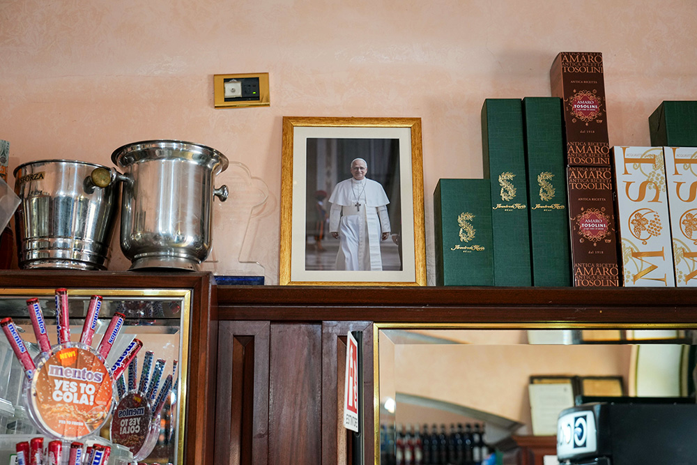 A framed photo of Pope Leo XIV is displayed inside a local café on the main square of Castel Gandolfo, Italy, July 1, 2025. (CNS/Lola Gomez)