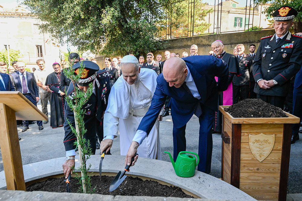 Pope Leo XIV takes part in a tree-planting ceremony with top officers of the Italian Carabinieri at their headquarters in Castel Gandolfo July 15, 2025. (CNS/Vatican Media)