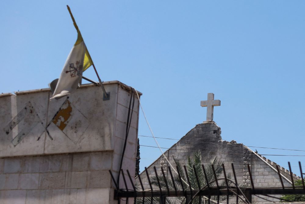 The Vatican City flag flies July 18 at Holy Family Church in Gaza City.