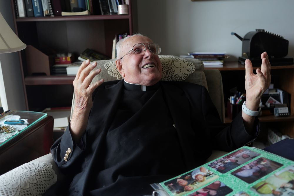 Fr. James Kelly laughs during an interview at his apartment. Fr. James Kelly laughs during an interview at his apartment.