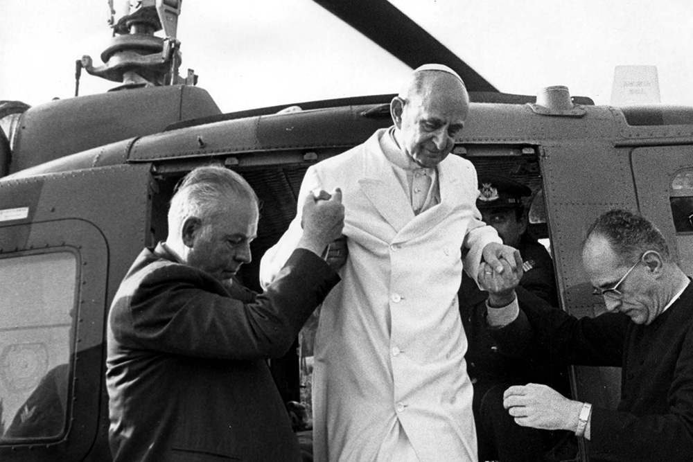 Vatican aides help Pope Paul VI out of a helicopter on his arrival at his summer residence in Castel Gandolfo, July 17, 1975, from Vatican City. (AP/Claudio Luffoli)