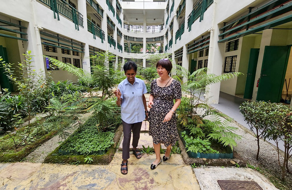Good Shepherd Sr. Jean Fernandez, left, takes a walk with a friend to enjoy a bit of nature. (Courtesy of Jean Fernandez)