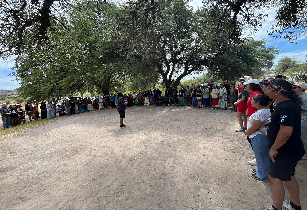 People gather in a circle for prayer after dance, song and teachings at Oak Flat. (Courtesy of Steve Pavey)
