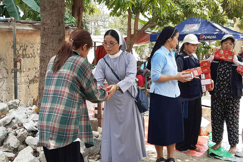 Catholic nuns distribute relief materials to the victims of a 7.7 magnitude earthquake in Mandalay, Myanmar. (Courtesy of Melanie Mai Chit Yin)