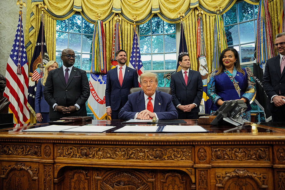 U.S. President Donald Trump, Secretary of State Marco Rubio and Vice President JD Vance pose with Rwanda's Foreign Minister Olivier Nduhungirehe, far left, and Democratic Republic of the Congo's Foreign Minister Therese Kayikwamba Wagner, far right, during the signing of a peace agreement in the Oval Office at the White House in Washington June 27. (OSV News/Reuters/Ken Cedeno)