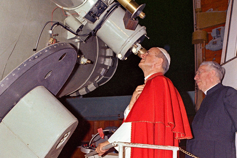 Pope Paul VI takes a peek through the telescope of the Vatican Observatory at Castel Gandolfo, Italy, to have a look at the moon, where the Apollo II astronauts were landing, on July 20, 1969. (AP)