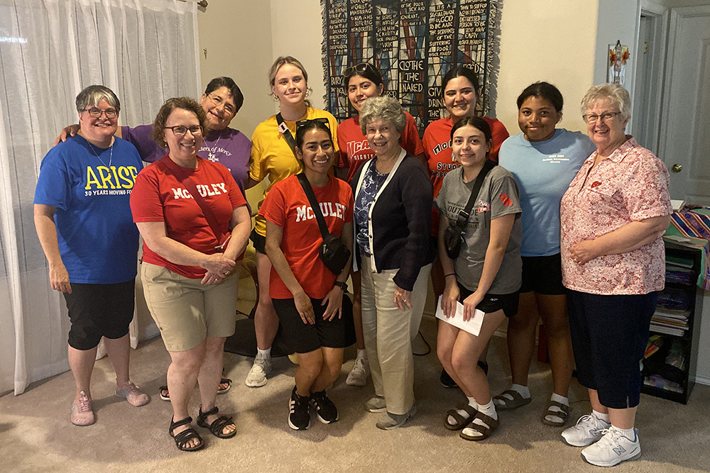 Sr. Jennnifer Wilson, on the left in the back, joins volunteers from Mother McAuley High School in Chicago at Arise Adelant's summer program for children in Alamo, Texas. (Courtesy of Jennifer Wilson)