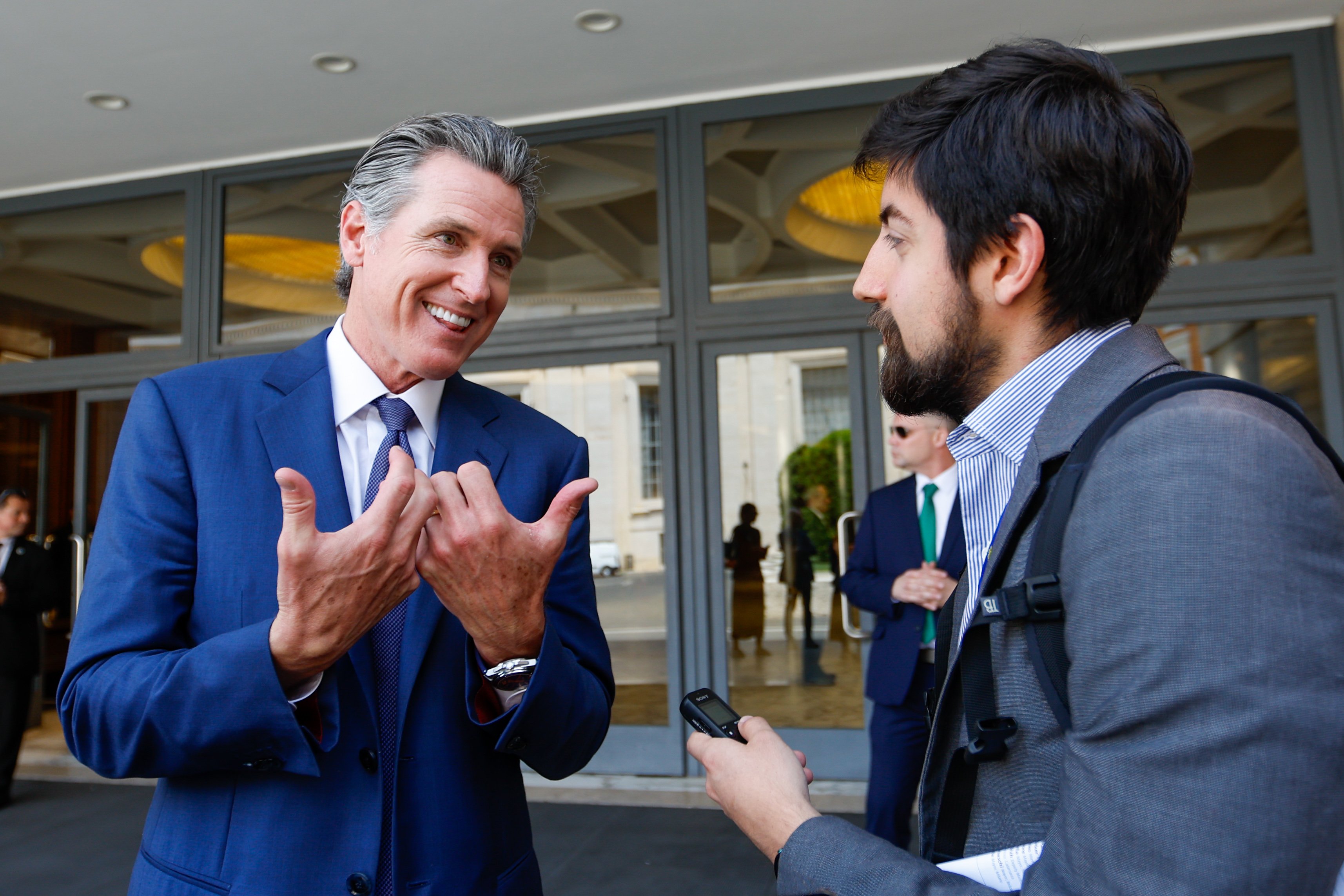 California Gov. Gavin Newsom speaks with Catholic News Service Correspondent Justin McLellan during a summit, titled "From Climate Crisis to Climate Resilience," outside the Paul VI Audience Hall at the Vatican May 16, 2024. (CNS photo/Lola Gomez)