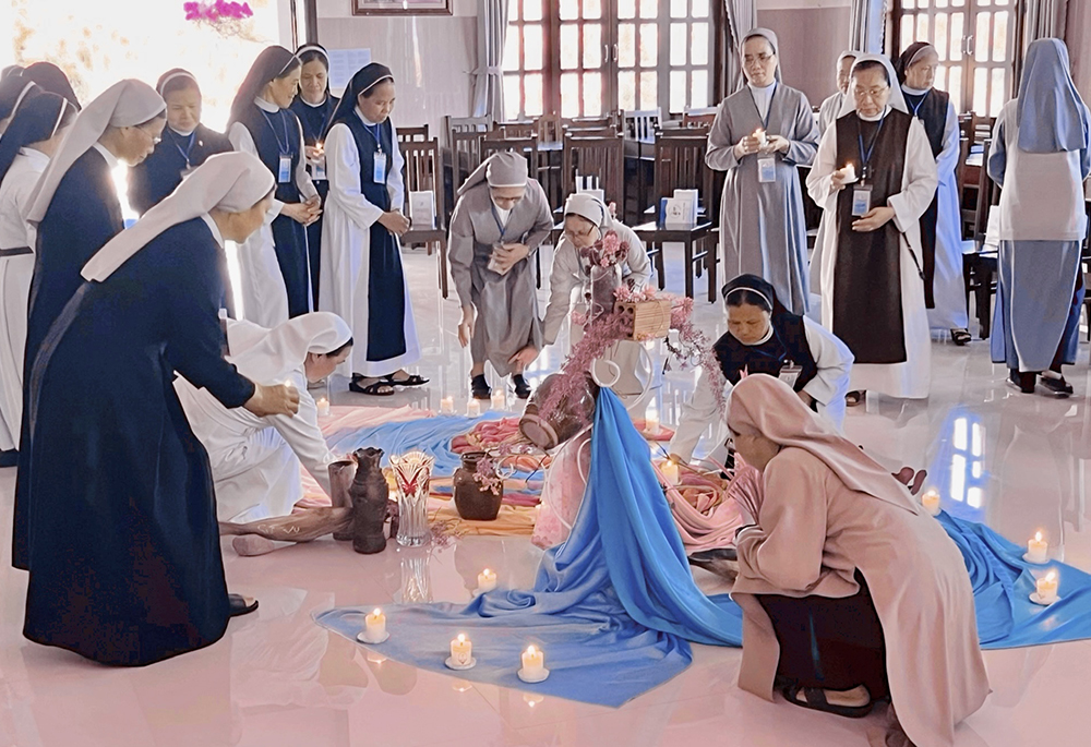 Sisters with lit candles in hands attend the opening ceremony of the first ever sabbatical course on March 18 at the Rosary Retreat House in the Lam Dong province of Vietnam. (Courtesy photo)
