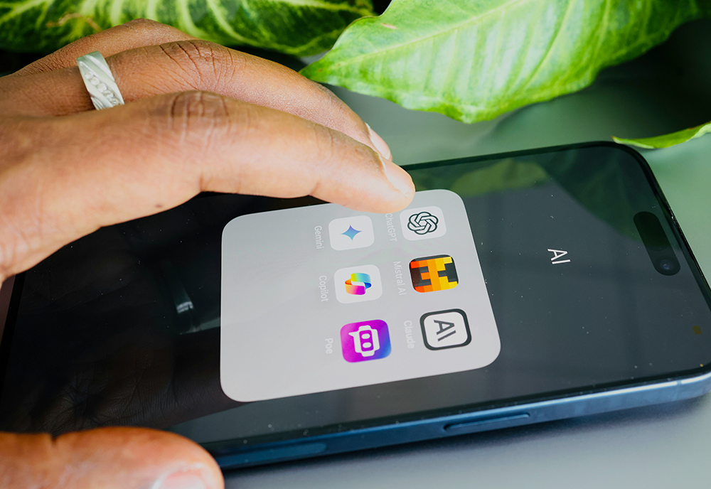 A hand hovers over a cellphone, about to tap the icon for ChatGPT. (Unsplash/Solen Feyissa)