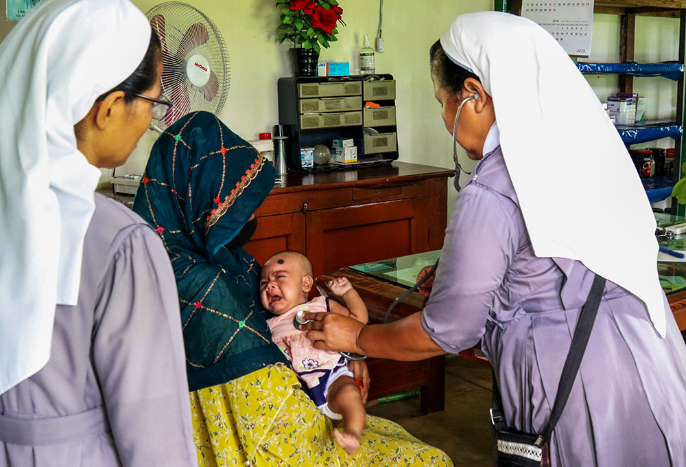 Salesian sisters treat a baby at Our Lady of Lourdes Hospital in Baromari, Sherpur, Bangladesh. According to recent data by UNICEF, more than 100,000 children in Bangladesh died before their fifth birthday in 2023, and almost two-thirds of these deaths occurred within the first 28 days of life. (GSR photo/Stephan Uttom Rozario)