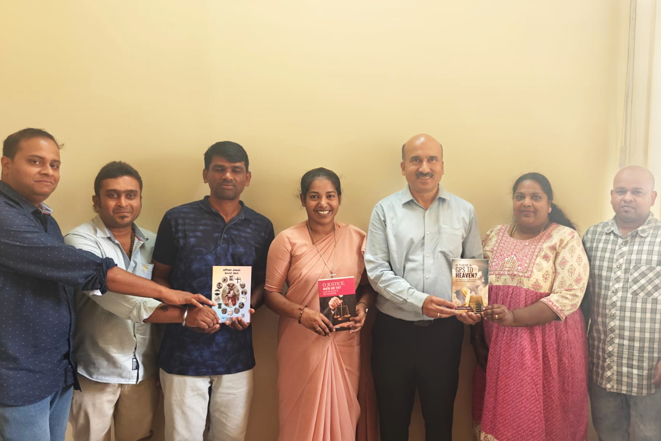 Sr. Lini Sheeja (center in sari) with the publishing team behind her books.