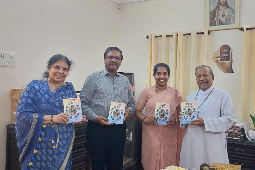 Sr. Lini Sheeja’s book, Sound of Silence, written in Malayalam, was released in 2025 by Archbishop Peter Machado of Bangalore (right). Sr. Lini Sheeja is pictured second from right. (Courtesy of Sr. Lini Sheeja)