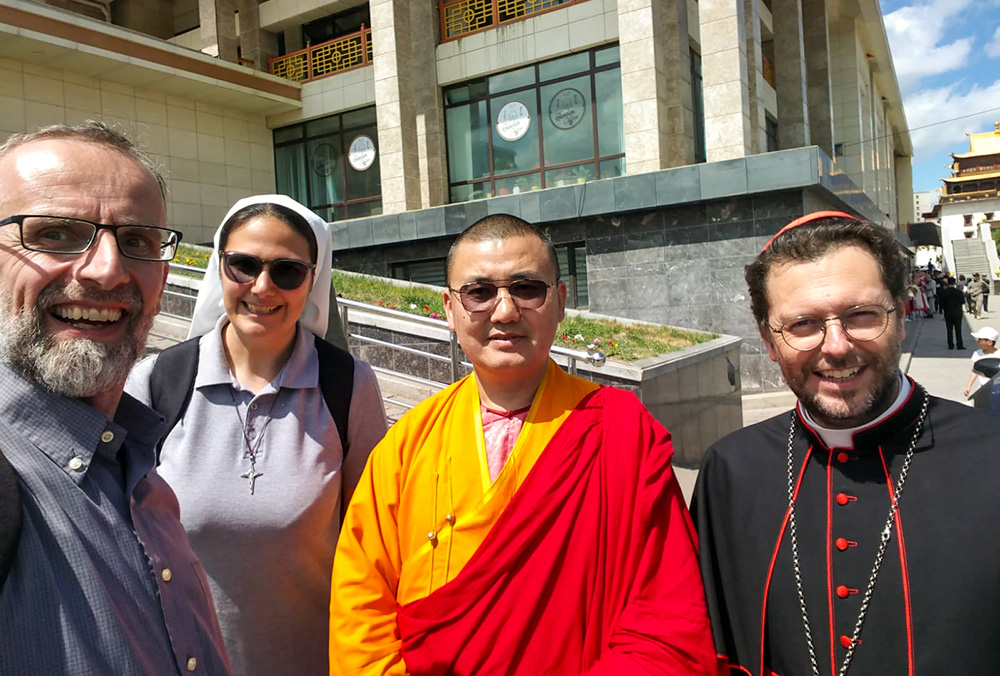 From left: Fr. Daniele Giolitti and Sr. Francesca Allasia, both Consolata Missionaries; a Buddhist monk of Gandan Monastery; and Cardinal Giorgio Marengo, during an interreligious dialogue event on Vesak Day at the monastery (Courtesy of Francesca Allasia)