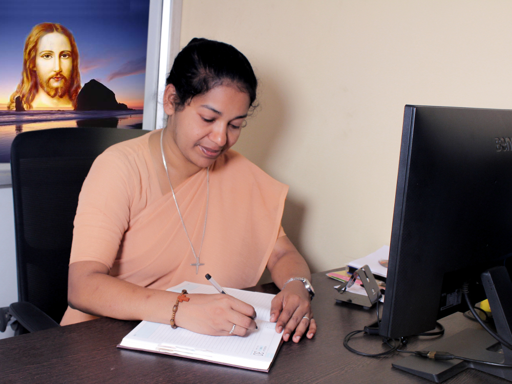 Sr. Lini Sheeja working in her office in 2020