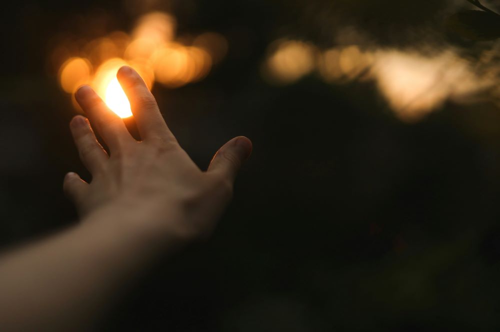 hand shown as if releasing something