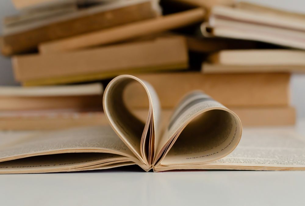 open book, pages forming heart