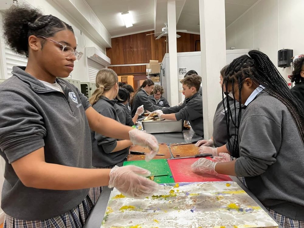 Students prepare lunches at the Rebuild Center in New Orleans.