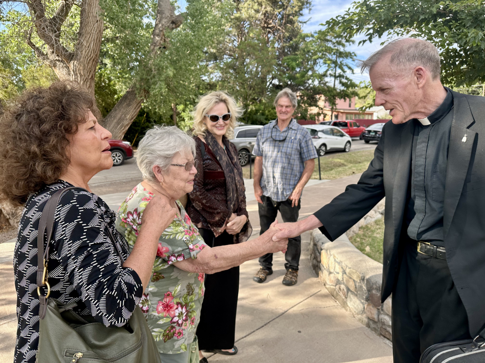 Archbishop Wester shaking hand of Rosalie Cordova, following a mass on July 16 2025, with Tina Cordova, Melissa Parke and Jay Coghlan looking on. (Courtesy of ICAN/Seth Shelden)