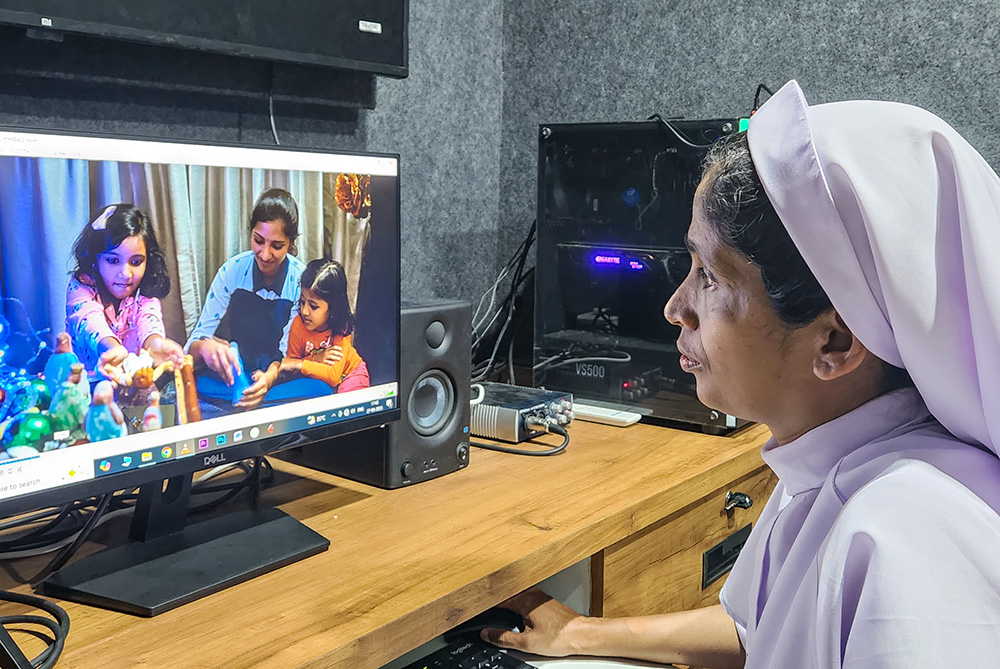 Sr. Seby Thomas, a member of the Missionary Sisters of Mary Immaculate, edits at her studio in Sultan Bathery in the southwestern Indian state of Kerala. (GSR photo/Lissy Maruthanakuzhy)