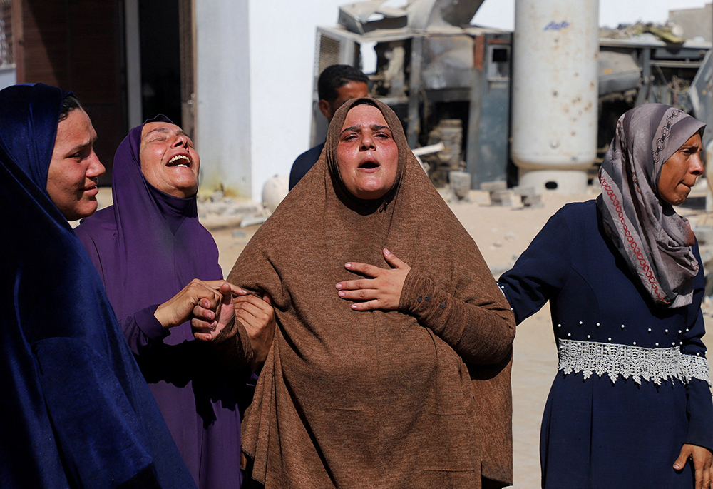 Mourners react during the funeral of Palestinians by Israeli fire who were reportedly trying to receive aid, according to medics, at Al-Shifa Hospital in Gaza City Sept. 11, 2025. (OSV News/Reuters/Ebrahim Hajjaj)