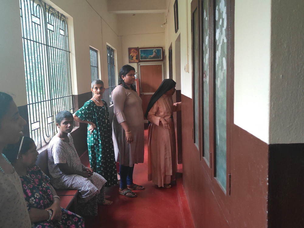 Bethany Sr. Bhagya Thalichirayil prepares to distribute medicine to the Asha Bhavan residents. (Thomas Scaria)