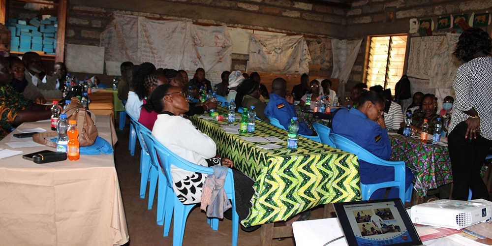 A gender-based violence meeting is pictured, organized by Brighten Her Future. A gender-based violence officer from Meru County spoke to attendees. Safe Space, a group that brings together community stakeholders to help with advocacy, includes the area chief, various health care professionals, police officers from the gender-based violence department, teachers and the Good Shepherd Sisters. (Courtesy of Doreen Mukami)