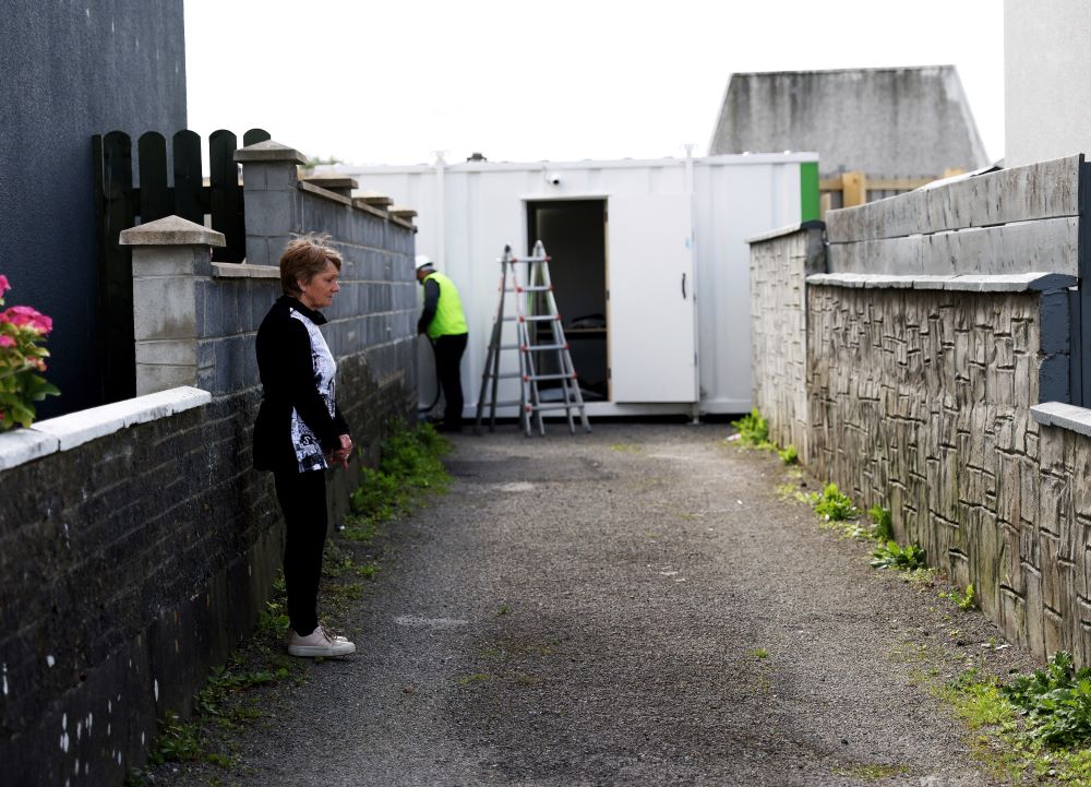 Historian Catherine Corless visits the excavation site of St Mary's home for unmarried mothers and their children, in Tuam, Ireland, July 7. An article Corless wrote about the former mother and baby home drew global interest in what happened to hundreds of babies who died there. (AP/Peter Morrison)