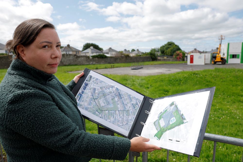 Senior forensic consultant Niamh McCullagh holds a map July 7  showing the planned excavation of the site in Tuam, Ireland, where the bodies of 796 babies are thought to have been buried at the site of a former mother-and-baby home run on behalf of the Irish government by the Catholic Sisters of Bon Secours. (OSV/Reuters/Clodagh Kilcoyne)