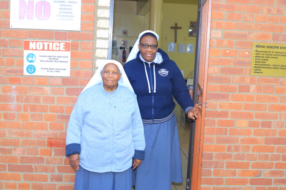 2 sisters outside building