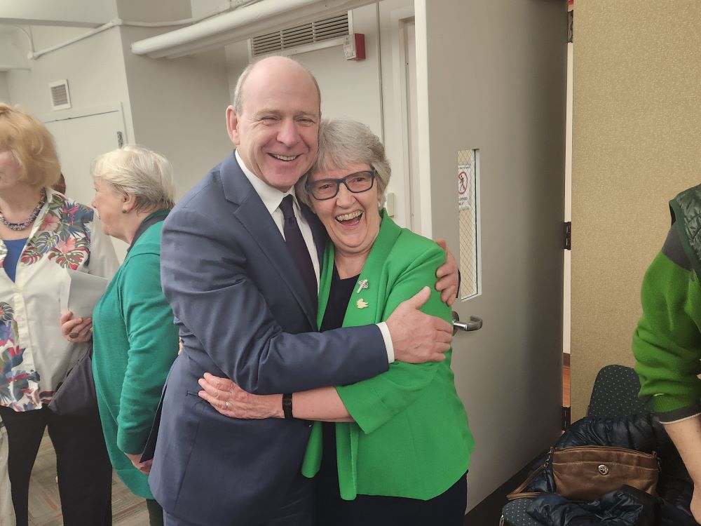 Sr. Winifred Doherty hugs Fergal Mythen. 