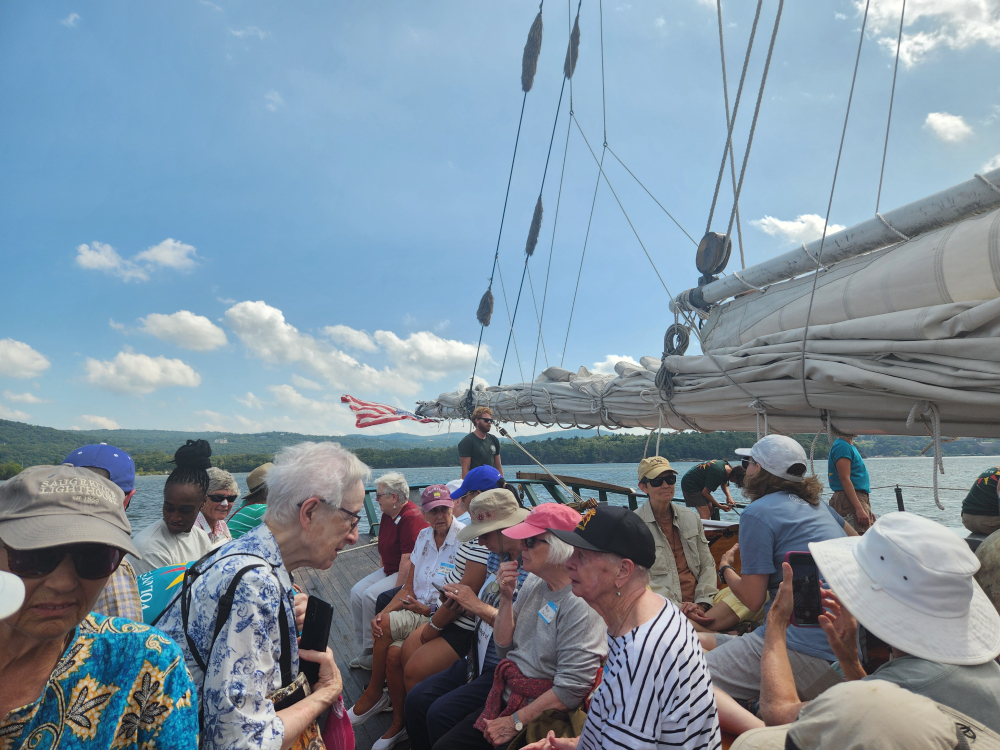 Participants settle in on the Hudson River sloop Clearwater. (GSR photo/Chris Herlinger)
