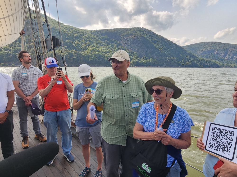John Lipscomb, center, a retired boat captain and activist with the environmental watchdog group Riverkeeper, spoke of growing up on the Hudson River.