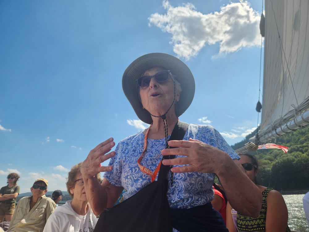 Sr. Carol De Angelo speaks to pilgrims during the afternoon journey. The pilgrimage "allowed time to be with other pilgrims, colleagues committed to and caring for the river, and to listen and learn from this living river, once a dying river, that has come back to life" she said of past environmental damage to the river and efforts — still ongoing  to clean the Hudson. (GSR photo/Chris Herlinger)