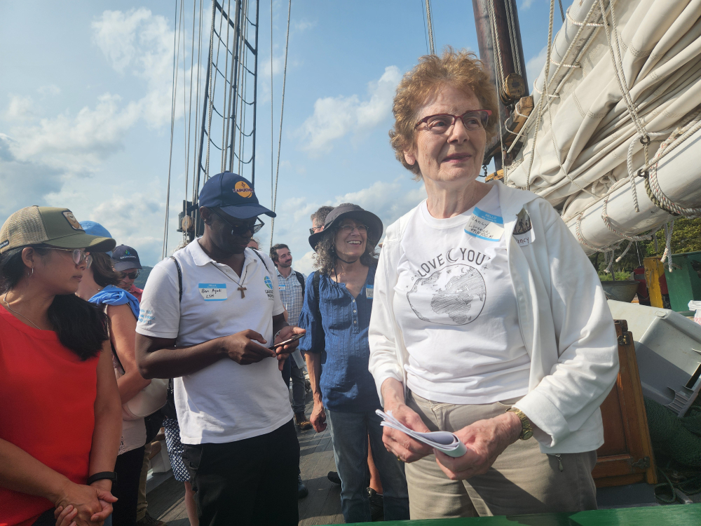 Nancy Lorence, right, a founding member of the Metro New York Catholic Climate Movement, speaks to pilgrims during the afternoon journey. Evoking the spirit and message of the late Pope Francis' 2015 encyclical Laudato Si', Lorence spoke of seeing everything in creation as being related. (GSR photo/Chris Herlinger)